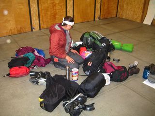 Maegan sorting through her winter gear