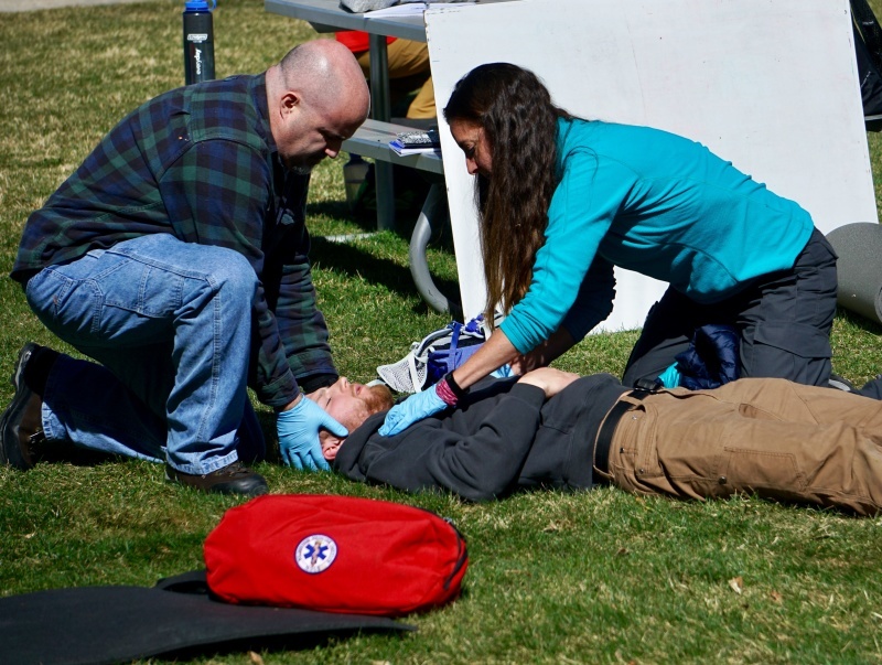 Practicing a patient assessment in a mock scenario for wilderness first aid Practicing a patient assessment in a mock scenario for wilderness first aid