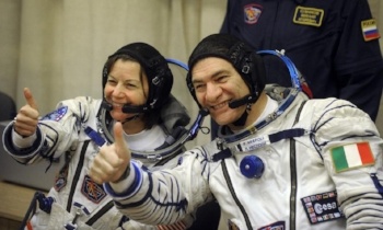 US astronaut Cady Coleman (L) and Italian astronaut Paolo Nespoli (R) photo by DMITRY KOSTYUKOV/AFP/Getty Images)