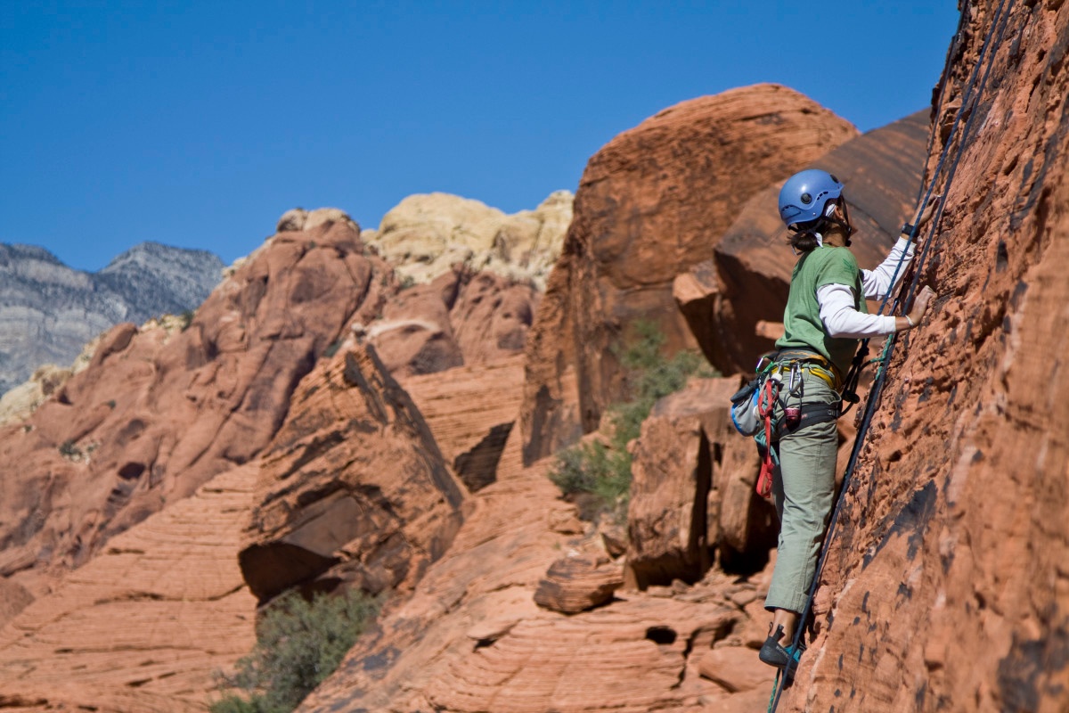 A person rock climbs in Red Rock, Nevada