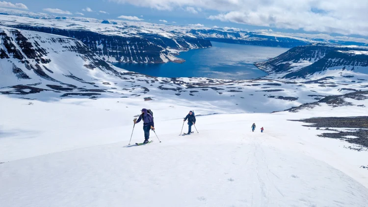 Skiers tour up the mountain in Iceland