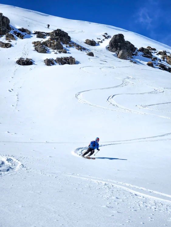 Skier makes turns down the slope in Iceland